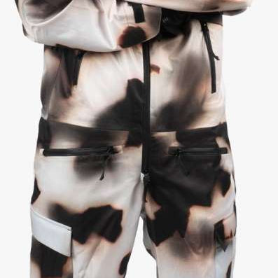 Endeavor 3L Shelter One Piece Suit 2024 - A black, white, and brown snowsuit with a zippered front and adjustable cuffs.