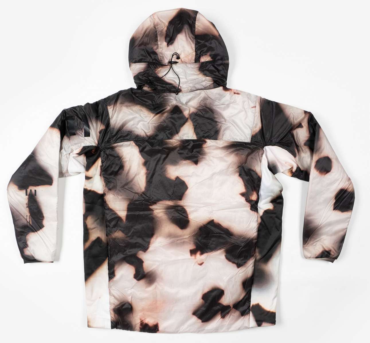 Endeavor Shelter Insulated Jacket 2024 - A black insulated jacket with a white snowflake pattern and a hood, laid flat on a solid background.