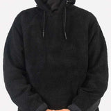 Endeavor Sherpa Riding Hoodie - A black hoodie with a sherpa lining and drawstring hood, worn by a model who is only visible from the waist up.