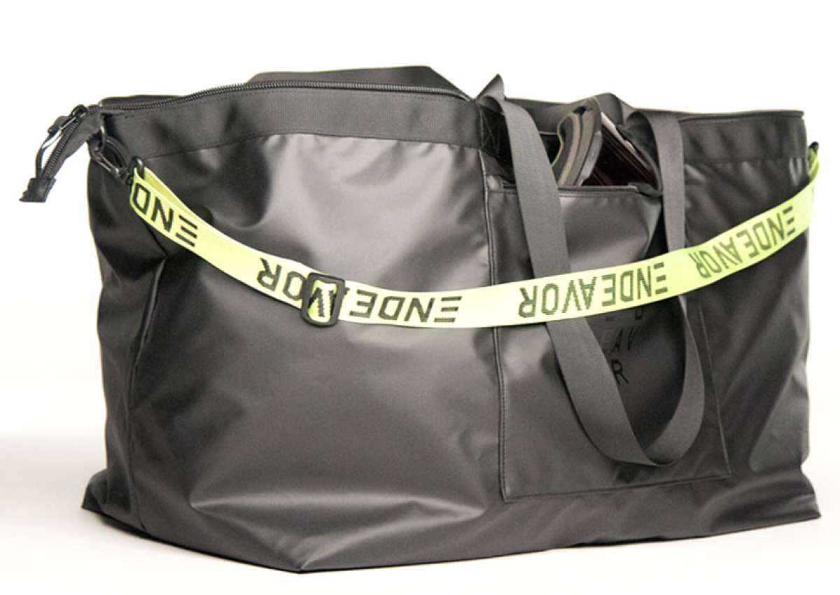 Endeavor Surplus Cargo Bag - A large, black duffel bag with a zippered top and two shoulder straps.