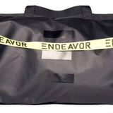 Endeavor Surplus Cargo Bag 2024 - A black duffel bag with a white logo and strap.