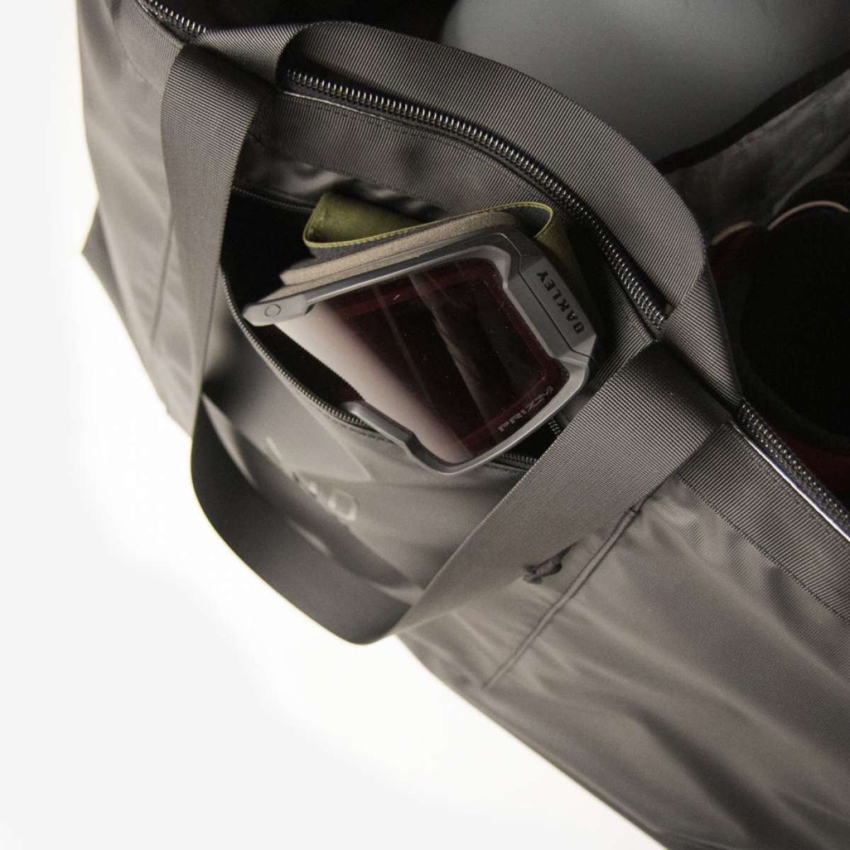 Endeavor Surplus Cargo Bag 2024 - Black nylon bag with zippered pockets and a handle on top.