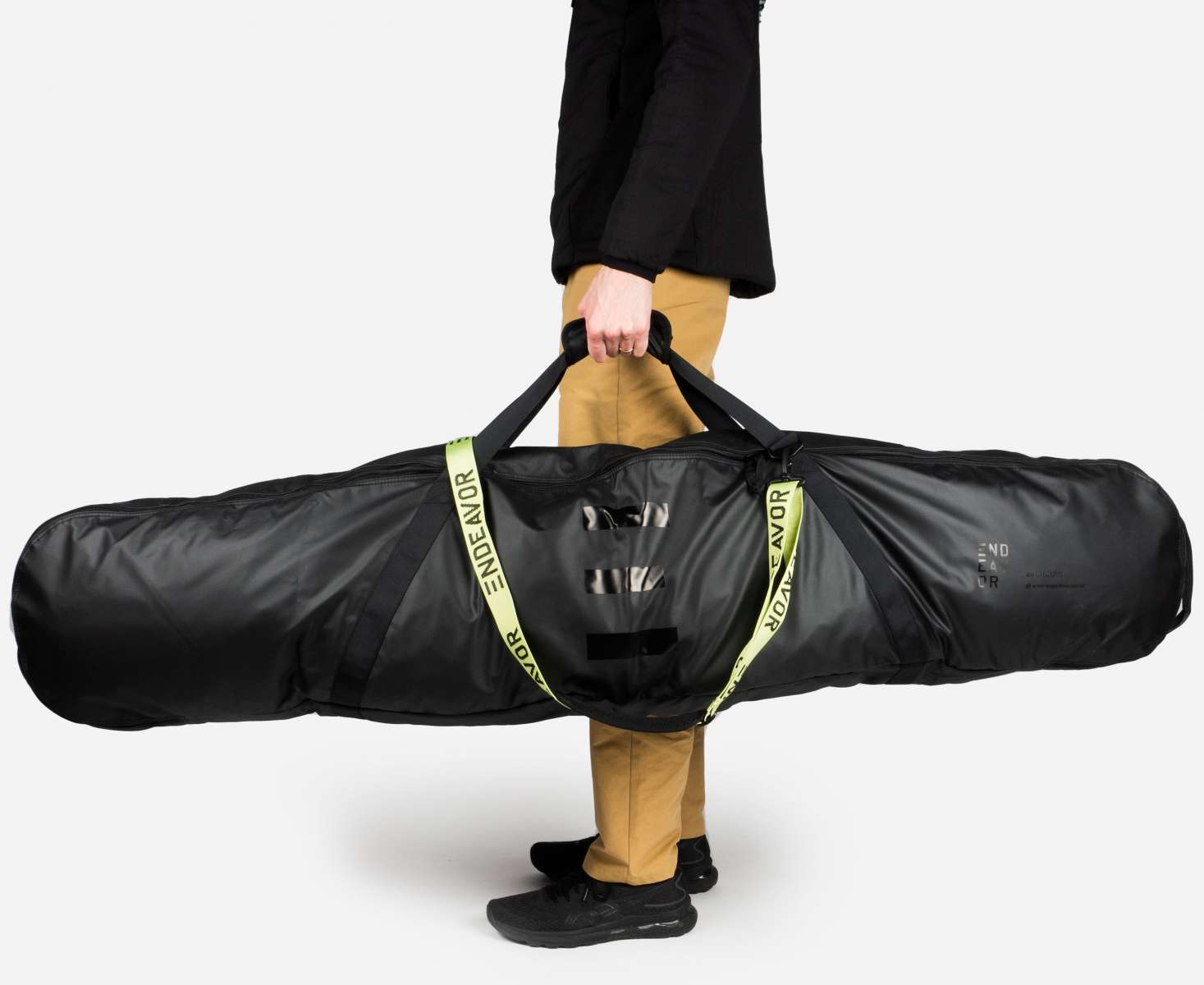 Endeavor Trail Snowboard Bag 2024 - Black bag with white logo and zipper on top, standing upright with two black handles.