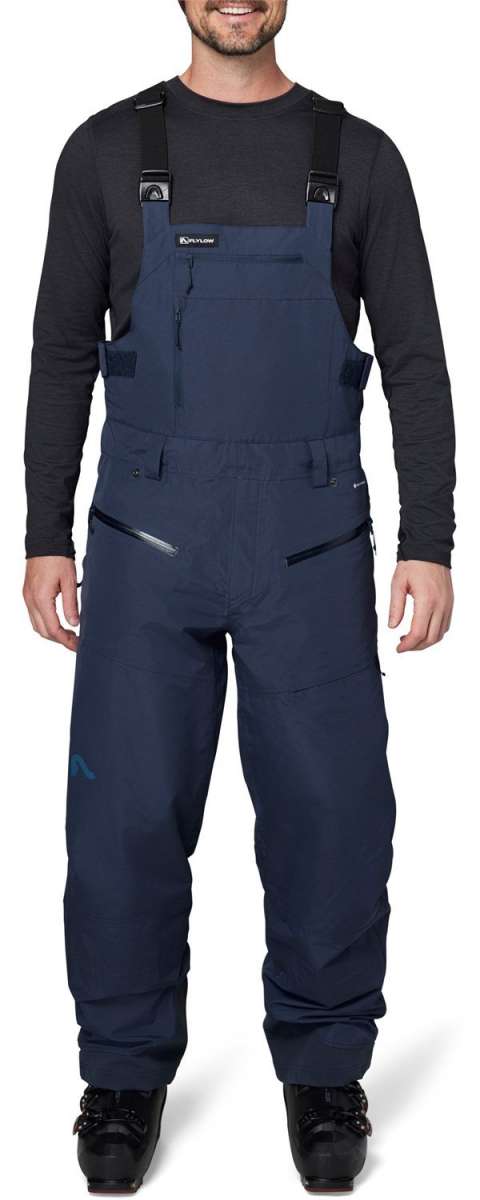 Flylow Firebird Shell Bib Pants 2024 - Dark blue bib pants with black buckles and straps, featuring a subtle white logo on the left thigh.
