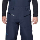Flylow Firebird Shell Bib Pants 2024 - Dark blue bib pants with black buckles and straps, featuring a subtle white logo on the left thigh.