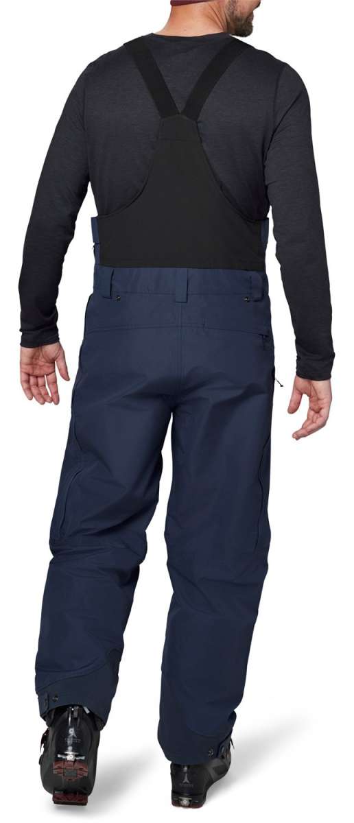 Flylow Firebird Shell Bib Pants 2024 - Black bib pants with a subtle white pattern on the front and back, featuring black suspenders and a black buckle.