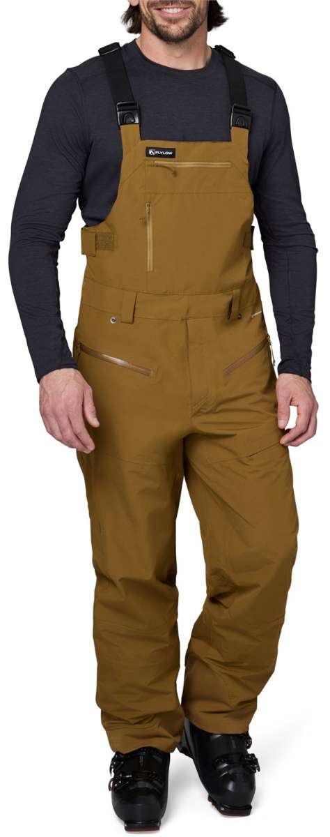 Flylow Firebird Shell Bib Pants 2024 - Black bib pants with black hardware and a subtle grid pattern on the side of the leg.