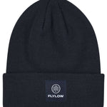 Flylow Longshoreman Beanie 2024 - A black beanie with a white logo featuring a mountain and trees in a circle, on the front.