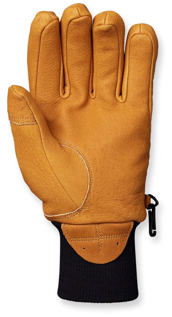 Flylow Magarac Glove 2024 - A tan-colored glove with a textured palm and thumb, featuring a black strap on the wrist.