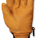 Flylow Magarac Glove 2024 - A tan-colored glove with a textured palm and thumb, featuring a black strap on the wrist.