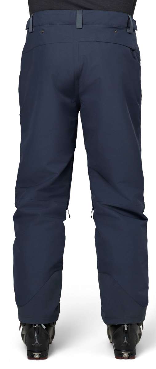 Flylow Patrol Shell Pant - Dark blue shell pant with diagonal zippered pockets on each thigh and a black zipper fly.