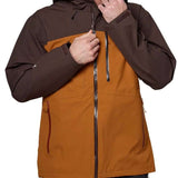 Flylow Quantum Pro Shell Jacket 2024 - A brown jacket with a black zipper and two zippered pockets on the front.
