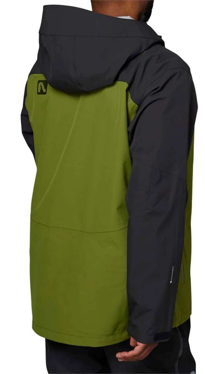 Flylow Quantum Pro Shell Jacket 2024 - A black jacket with a green panel on the left side and a hood, featuring a logo patch on the upper back.