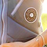 Follow Women's Atlantis Impact Vest 2023 - Black vest with white logo on chest and silver zipper down front.