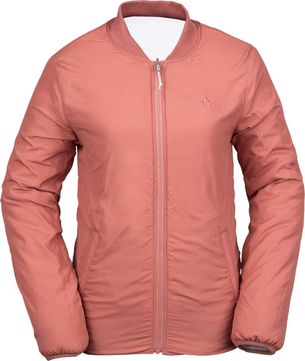 Volcom Women's Reversible Polar Shell Jacket 2020 - A dusty rose-colored jacket with a high collar and zippered front, featuring a small embroidered logo on the left chest area.