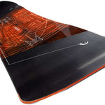 Head Anything Lyt Snowboard 2024 - A black snowboard with a red and white logo on top of a wood grain patterned background.