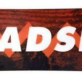 Head Anything Lyt Snowboard 2024 - A brown snowboard with a geometric pattern and white lettering on top.