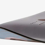 Head Day Lyt Snowboard 2023 - A snowboard with a light blue top and dark gray bottom, featuring a subtle wood grain pattern on its surface.