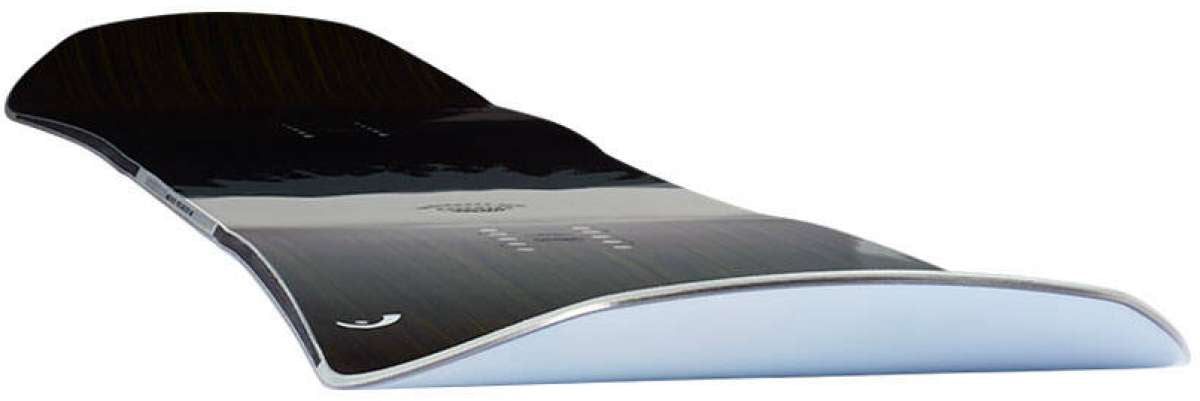 Head Daymaker Snowboard 2024 - A black snowboard with a white stripe and silver trim, viewed from an angle that highlights its curved shape.