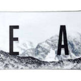 Head Daymaker Snowboard 2024 - A white snowboard with a black logo on top and a black stripe at the bottom.