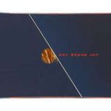 Head Daymaker Lyt Snowboard 2024 - A dark blue snowboard with a red logo on top and a light brown wood grain texture at the tip.