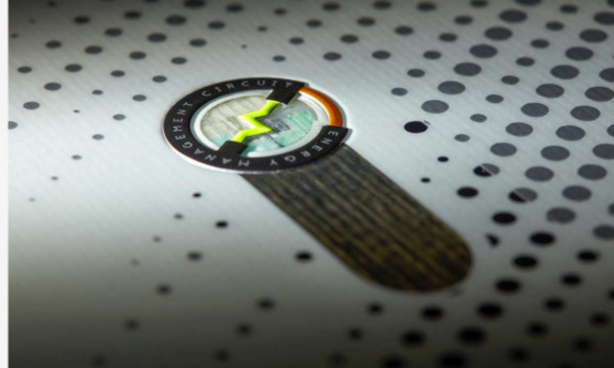 Head E Instinct LYT Snowboard 2023 - A black snowboard with a white stripe down the middle and yellow accents on the bindings.