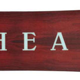 Head Gamechanger Snowboard 2024 - A dark brown snowboard with a subtle wood grain pattern and white lettering on top.