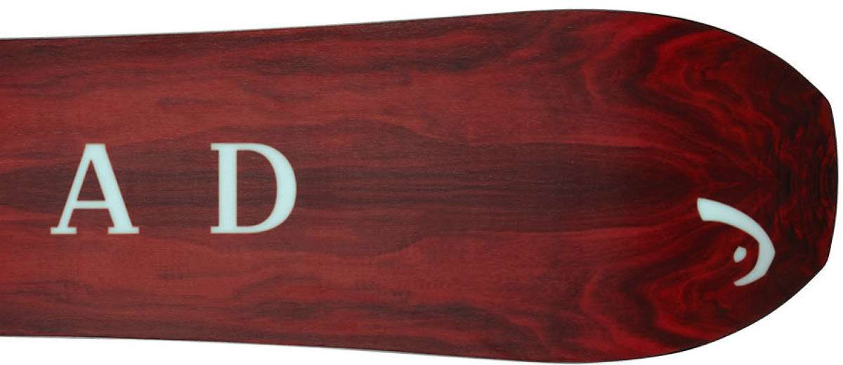 Head Gamechanger Snowboard 2024 - A dark brown snowboard with a white logo on the top left corner.