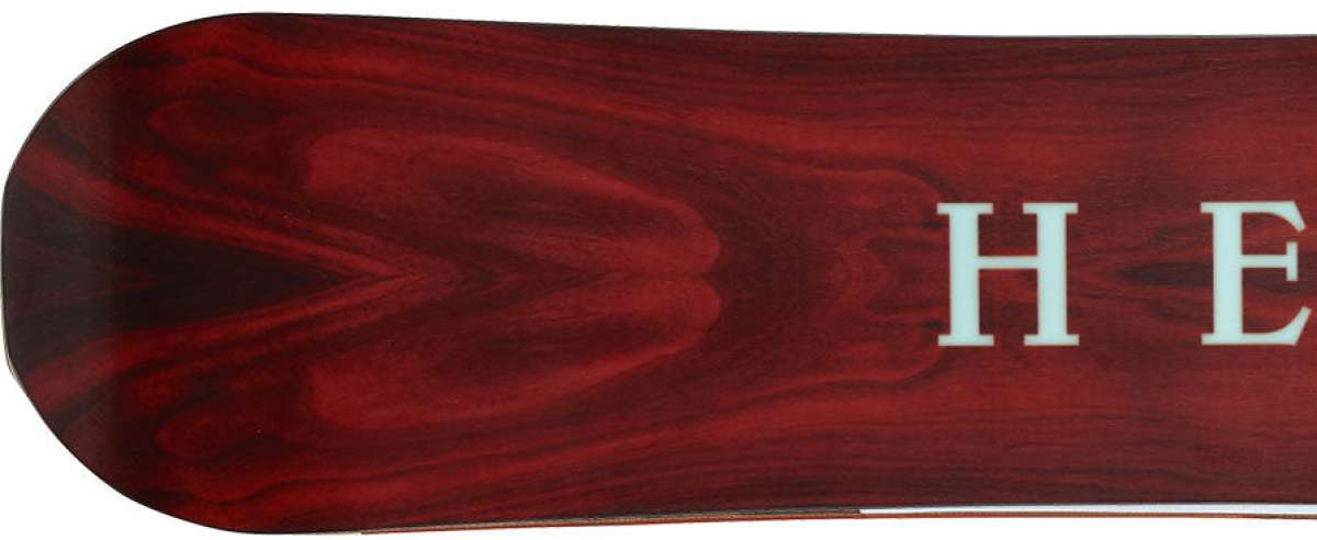 Head Gamechanger Snowboard 2024 - A dark brown snowboard with a subtle wood grain pattern and white lettering on the top sheet.