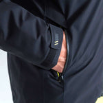 Head Neo Insulated Jacket 2023 - A black insulated jacket with a zippered front and yellow accents on the zipper, cuffs, and logo.