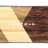 Head Transit Snowboard 2023 - A brown snowboard with a geometric pattern on top of a light-colored wood grain background.
