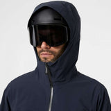 Helly Hansen - A dark blue jacket with a hood, featuring a zipper and two zippered pockets on the front.