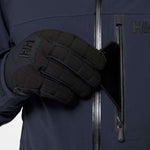 Helly Hansen - A dark blue jacket with a black zipper and two zippered pockets on either side.