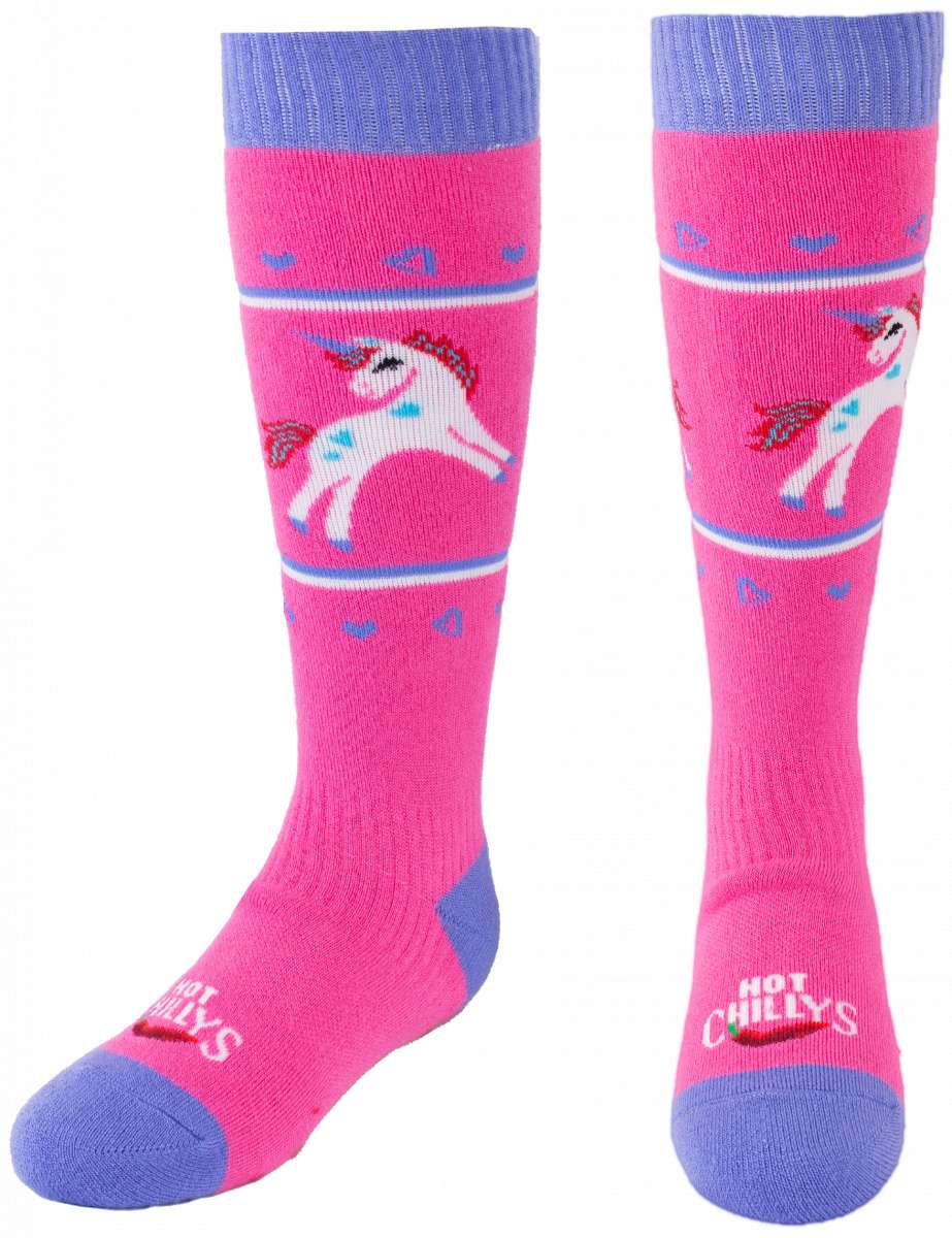 Hot Chillys - Youths magical friend mid volume sock with a unicorn design on a pink background.