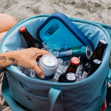 Hydro Flask - Medium blue ice pack with a circular shape, ridged edges, and a small handle on top.