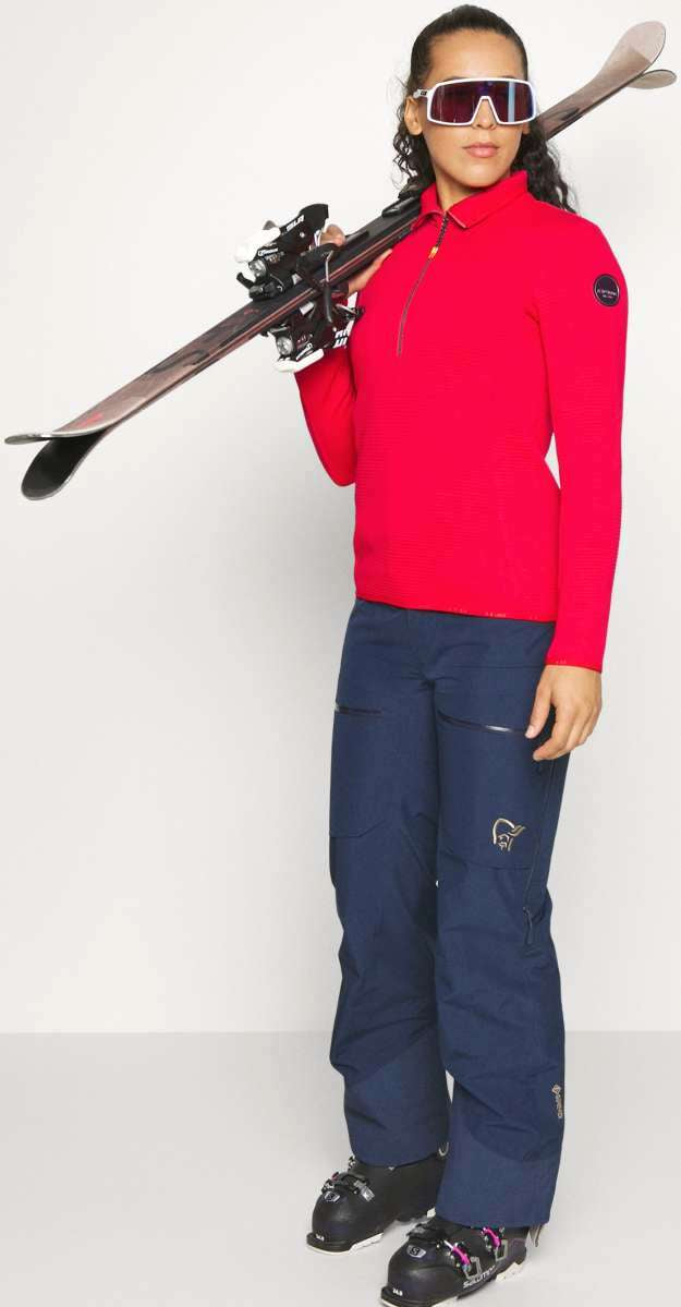 Icepeak Ladies Evansdale 1/4 Zip Top 2022-2023 - A red zip-up top with a collar and zipper down the front, worn by a model.