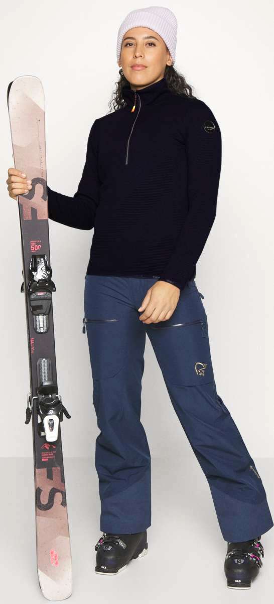 Icepeak Ladies Evansdale 1/4 Zip Top 2022-2023 - A black quarter-zip sweater with a zipper and collar, worn by a woman in a white beanie.