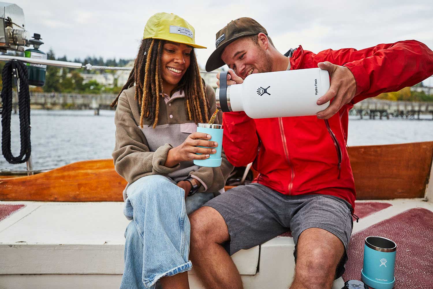 Hydro Flask 12oz Cooler Cup - A white cooler cup with a black lid, featuring a small logo on the side.
