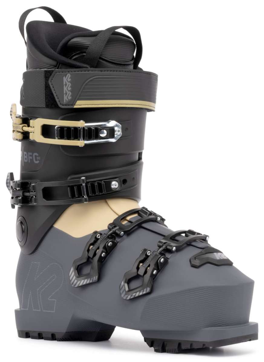 The K2 BFC 90 GW Ski Boot for the 2021-2022 season is a black and gray boot with a gold buckle, featuring a sturdy design with straps and a high top.