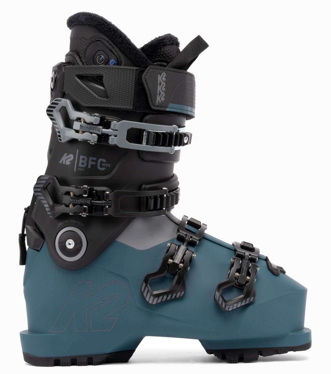 The image shows a pair of K2 Ladies BFC 95 Heat GripWalk Ski Boots for the 2021-2022 season. The boots are gray and blue in color, with black straps and buckles. They feature a heat grip sole for better traction on snowy surfaces.