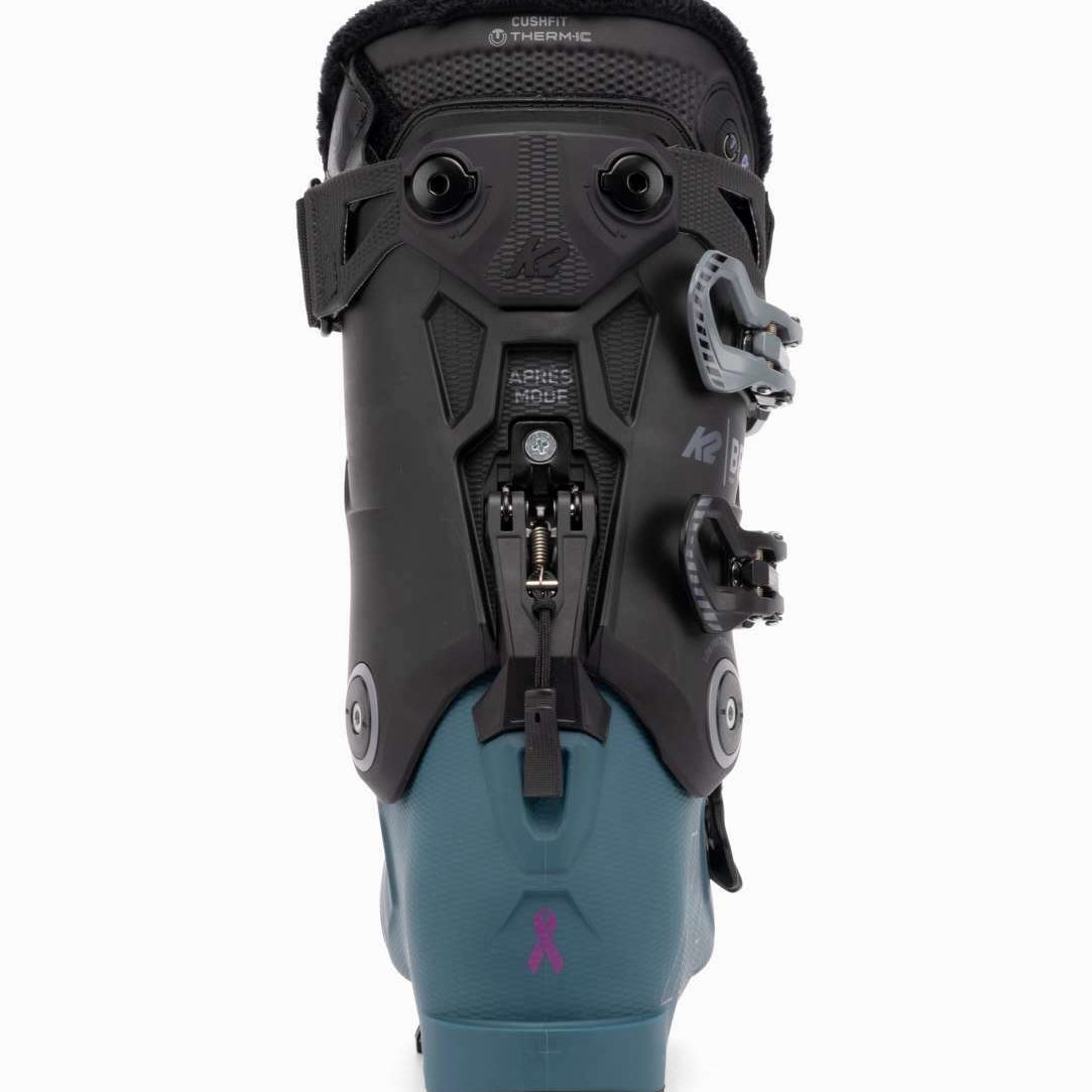 The K2 Ladies BFC 95 Heat GripWalk Ski Boots for the 2021-2022 season are displayed. These boots feature a blue and black color scheme, with a heat grip sole for added traction on snowy surfaces. The boots have a buckle closure system for secure fit and comfort.