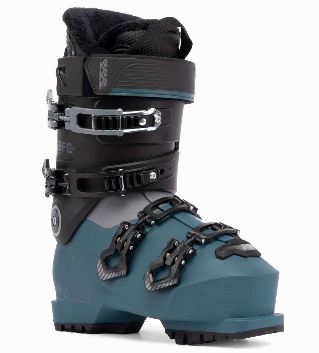 The K2 Ladies BFC 95 Heat GripWalk Ski Boots for the 2021-2022 season are displayed. These boots feature a gray and black color scheme, with a heat grip sole for added traction on snowy surfaces. The boots have a sturdy design, suitable for skiing activities, and are designed to provide comfort and support during winter sports.
