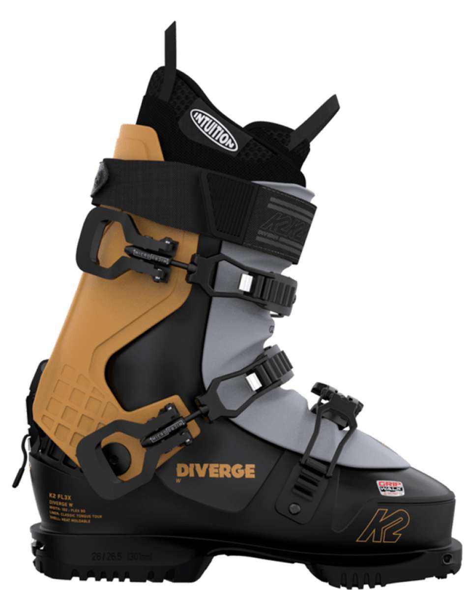 The K2 Women's Diverge 90 Ski Boots for 2023 are displayed. They have a black and tan color scheme, with the brand name prominently visible on the side of the boot. The boots feature a BOA closure system and are designed to provide support and comfort during skiing activities.