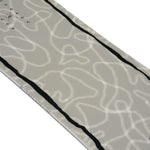 K2 Women's First Lite snowboard, 2024 model, features a gray and white graphic design.