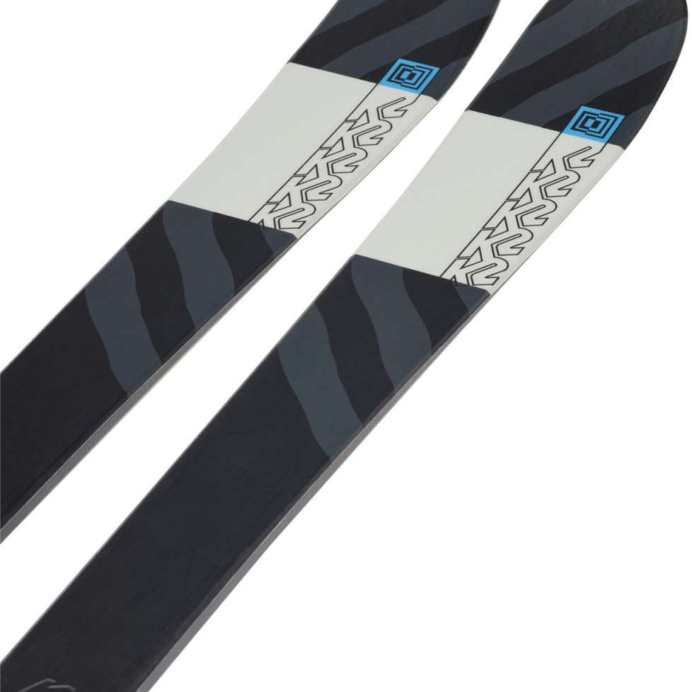 K2 Mindbender 85 skis feature a black and white design with red accents.