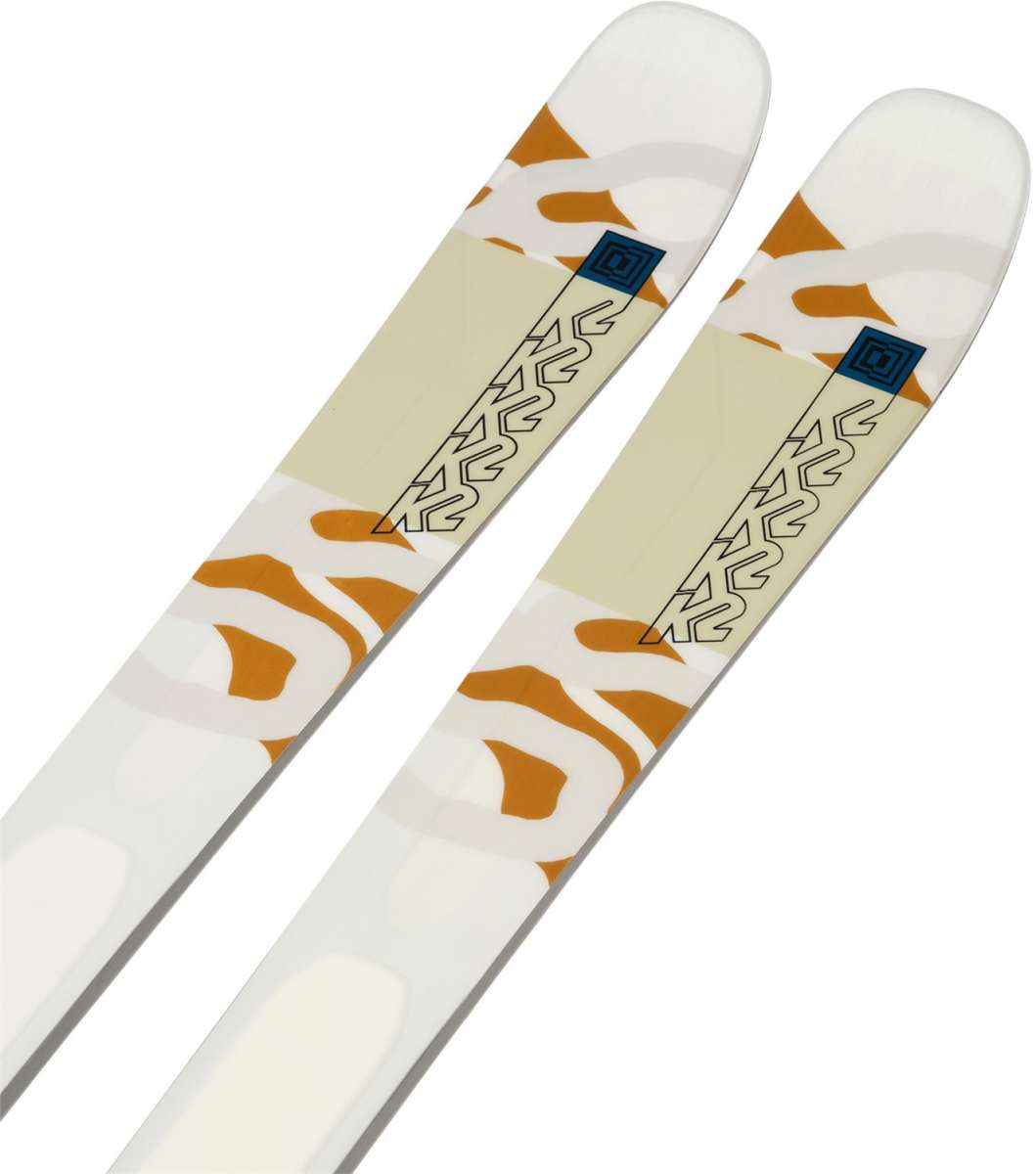 K2 Women's Mindbender 89Ti skis, 2024 model, feature a white and red design with distinctive graphics.