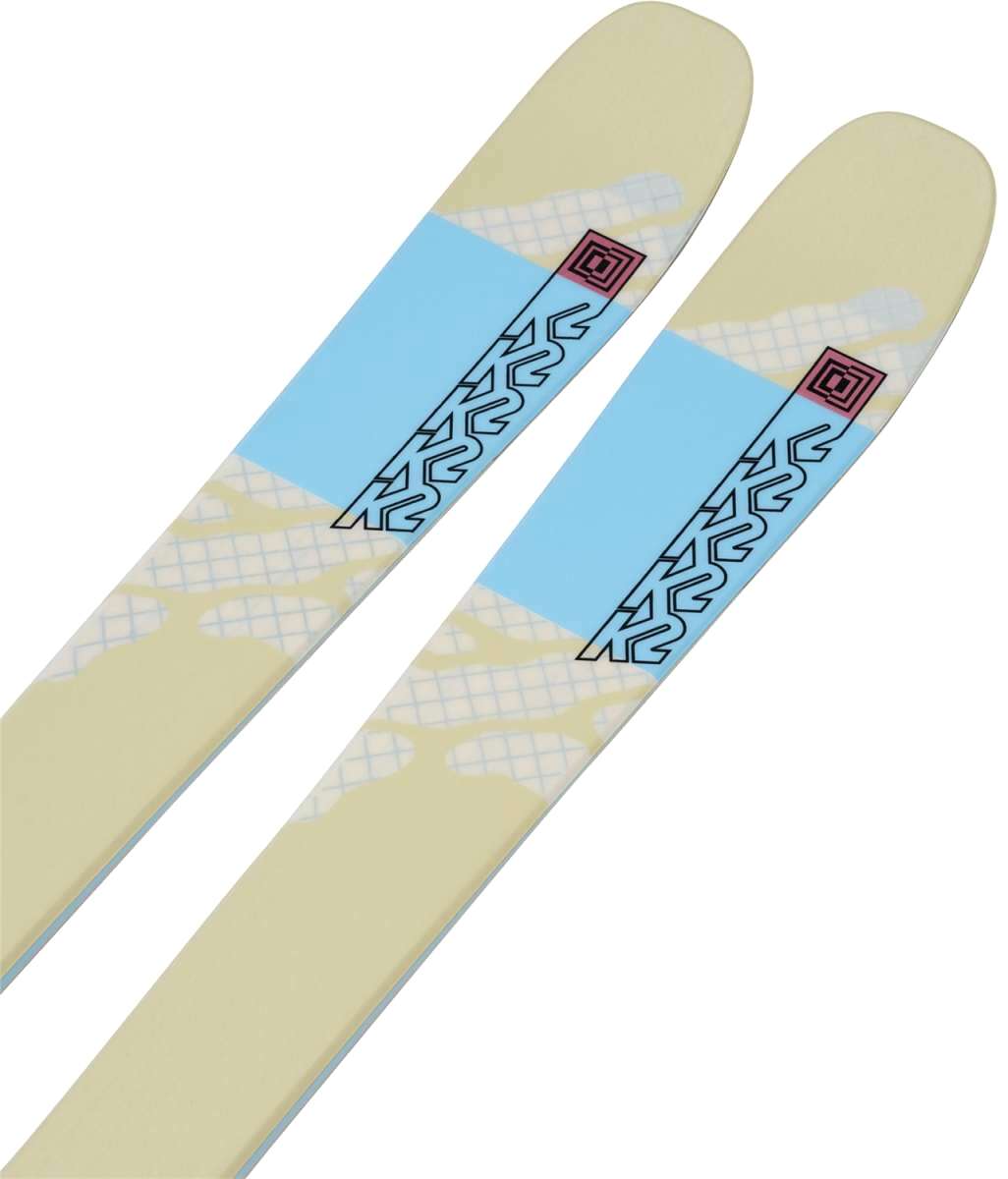 K2 Women's Mindbender 90C skis, 2024 model, feature a yellow and black graphic design.