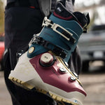 K2 Mindbender 95 BOA ski boots feature a pink and gray color scheme with visible BOA dial.