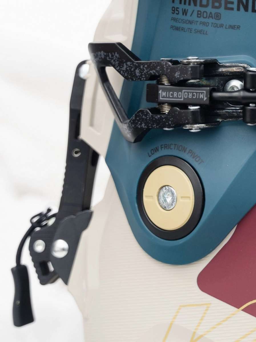 K2 Mindbender 95 BOA women's ski boots feature a blue and white design with visible BOA adjustment dials.