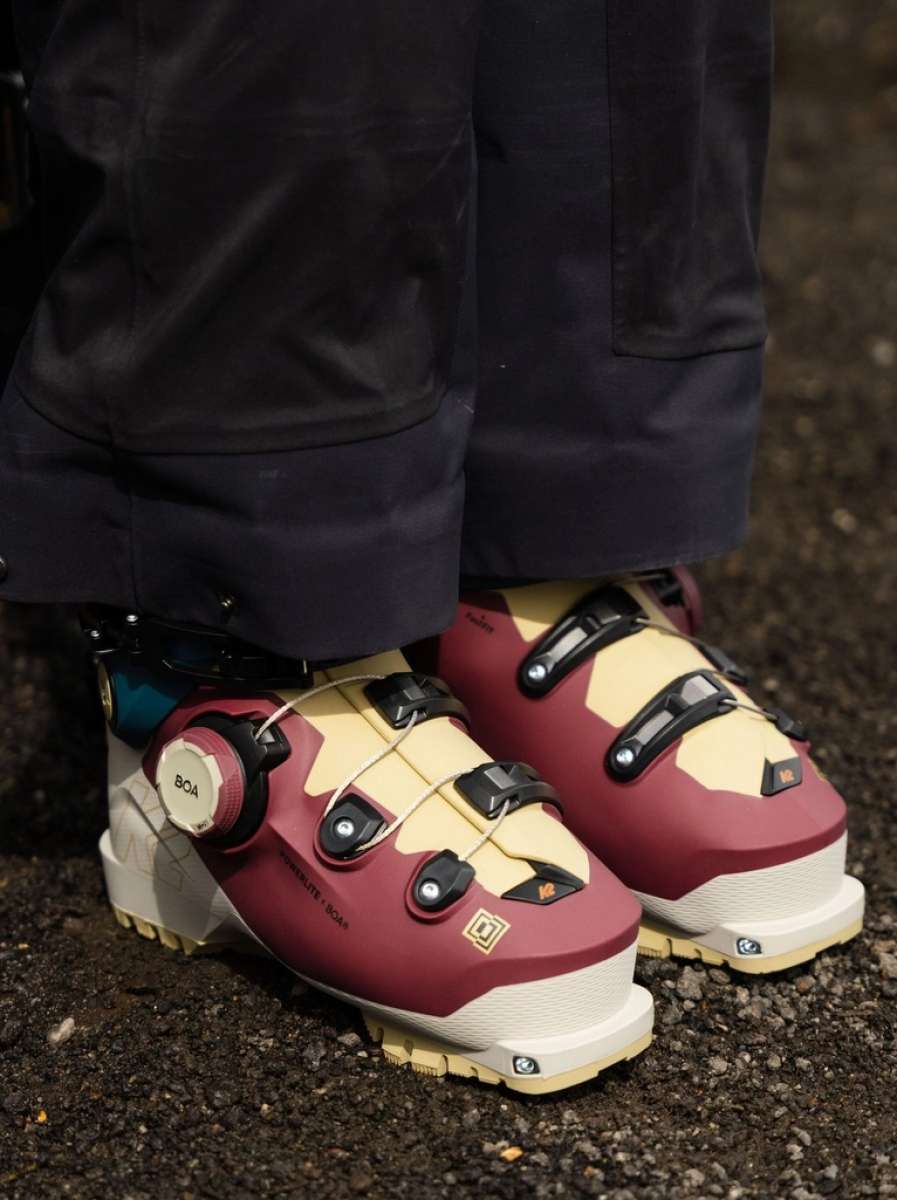 K2 Mindbender 95 BOA ski boots feature a yellow and white color scheme with visible BOA dials.